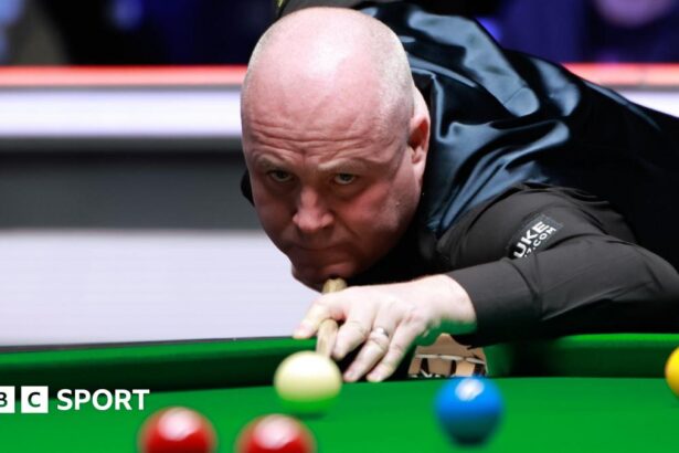 Tour Championship: John Higgins into final after 10-7 win over Barry Hawkins in Manchester