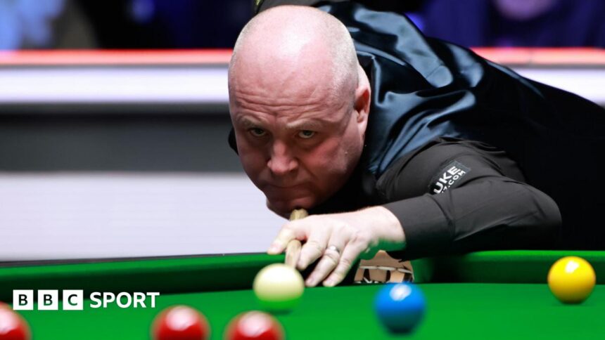 Tour Championship: John Higgins into final after 10-7 win over Barry Hawkins in Manchester